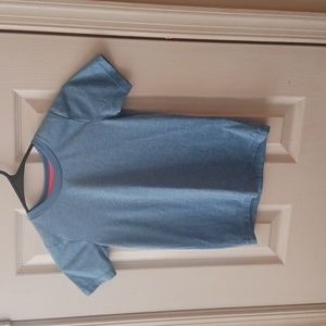 Mad Game size 6/7. Blue short sleeve shirt.
